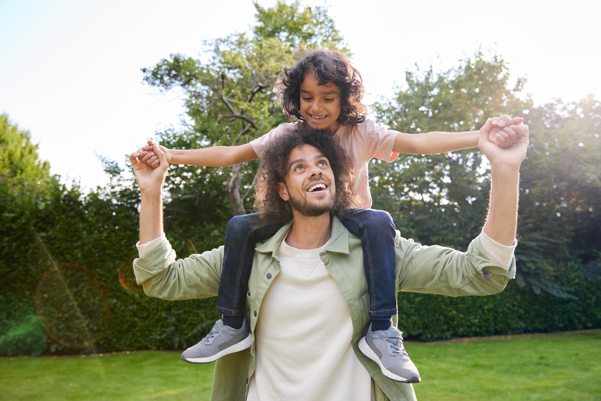 Copy of father-with-son-on-shoulders-and-arm-outstretched-2024-12-05-04-34-27-utc