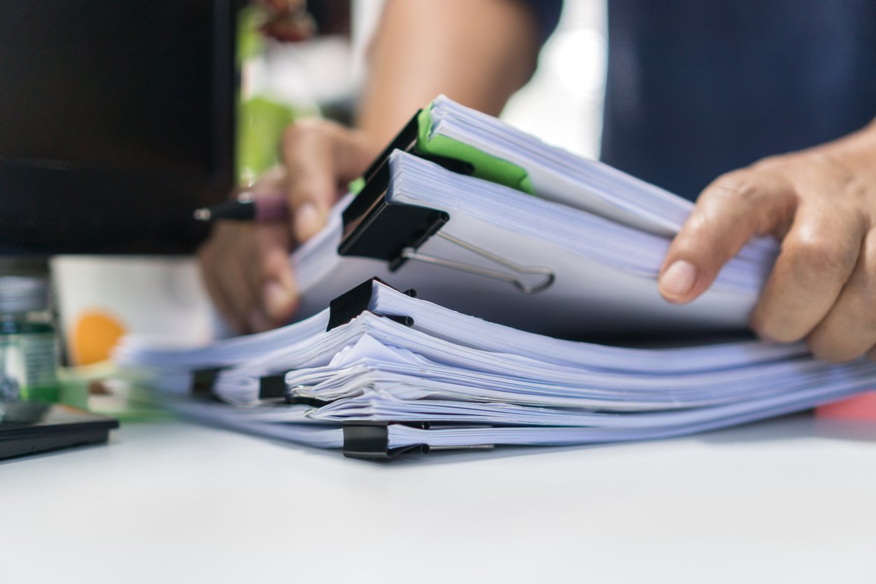 Desk piled with files